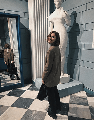 Photo of a girl with a statue